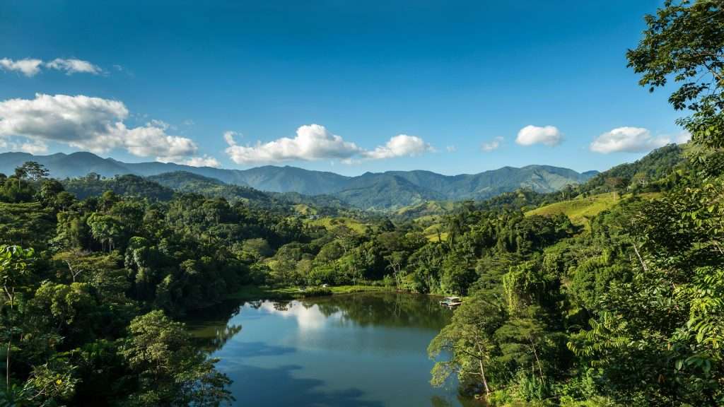 A river winding through green hills and mountains in Panama.