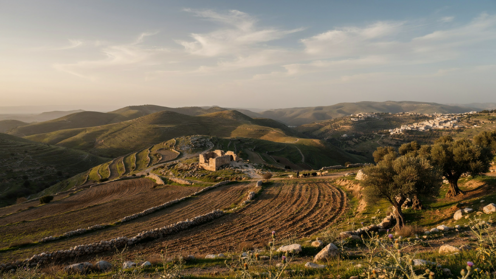Terraced hills and a small village in Israel.