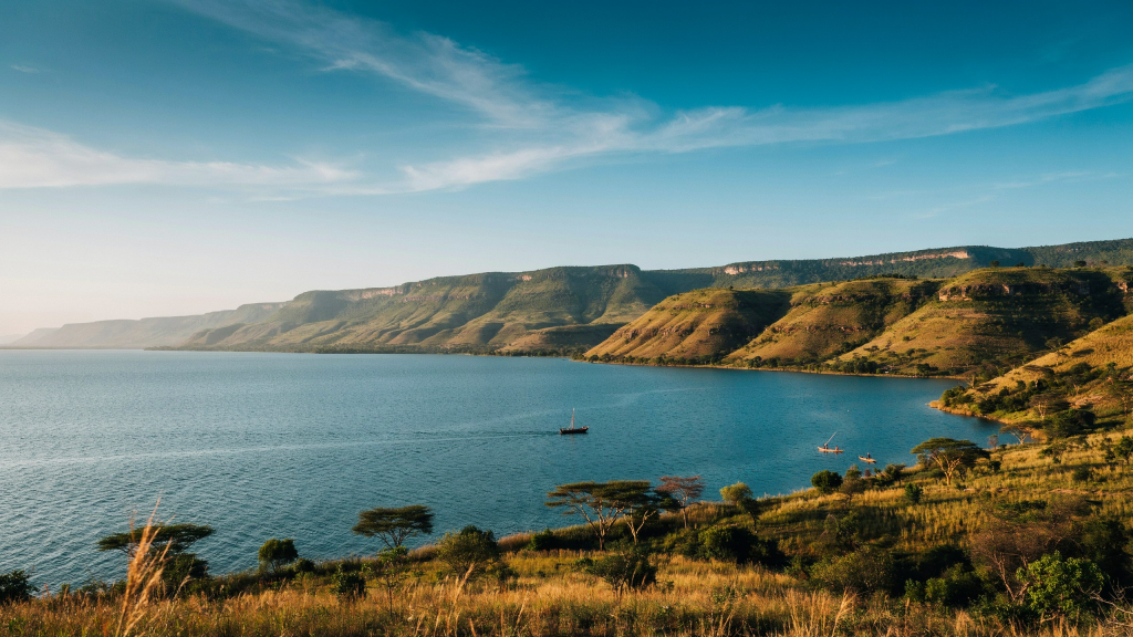 A calm lake beside rocky hills in Malawi.