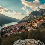 A coastal town beside a bay with mountains in Montenegro.