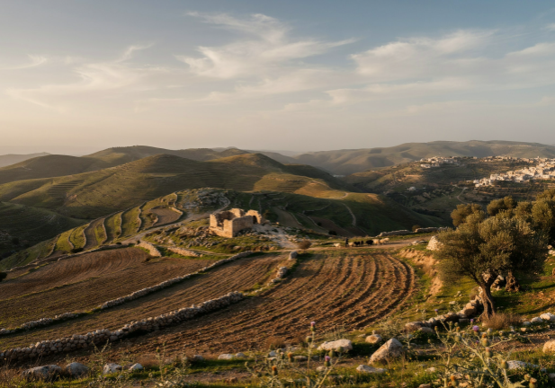 Terraced hills and a small village in Israel.