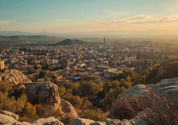 Rocky hills overlook a sprawling cityscape in Azerbaijan.